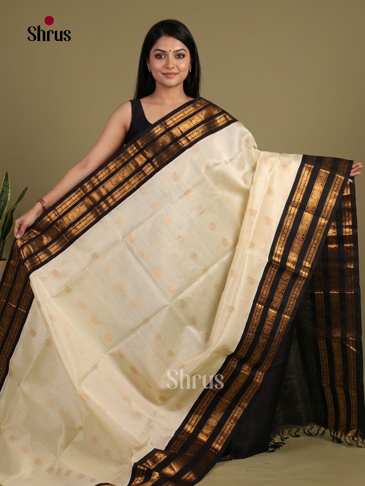 Charming Cream & Black Silk Cotton Saree with zari floral buttas & striped Pallu