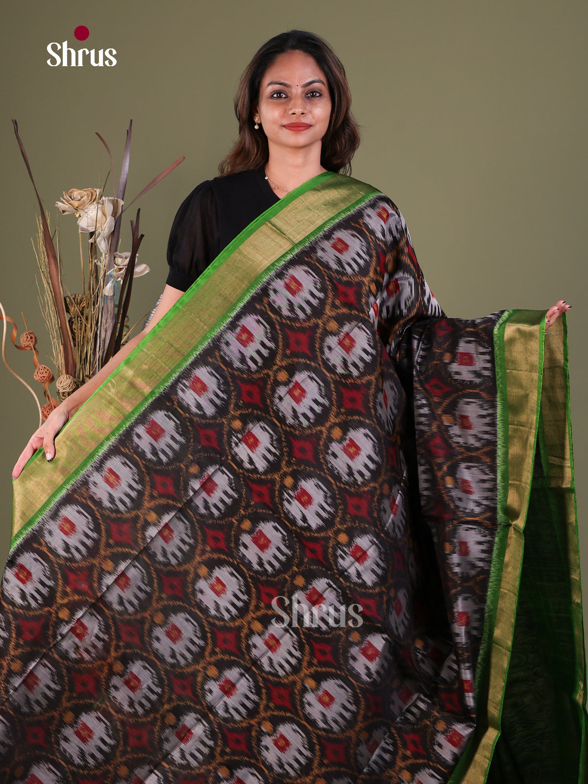 Elegant Black Pochampally Cotton Silk Saree With Elephant Prints & Green Kaddi Border