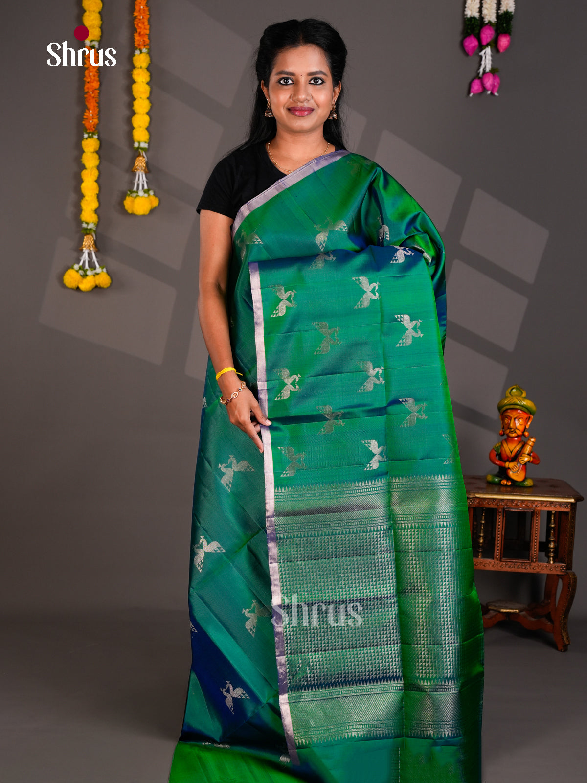Pretty Emerald Green Soft Silk Saree With Silver Peacock Motifs & Brocade Pallu