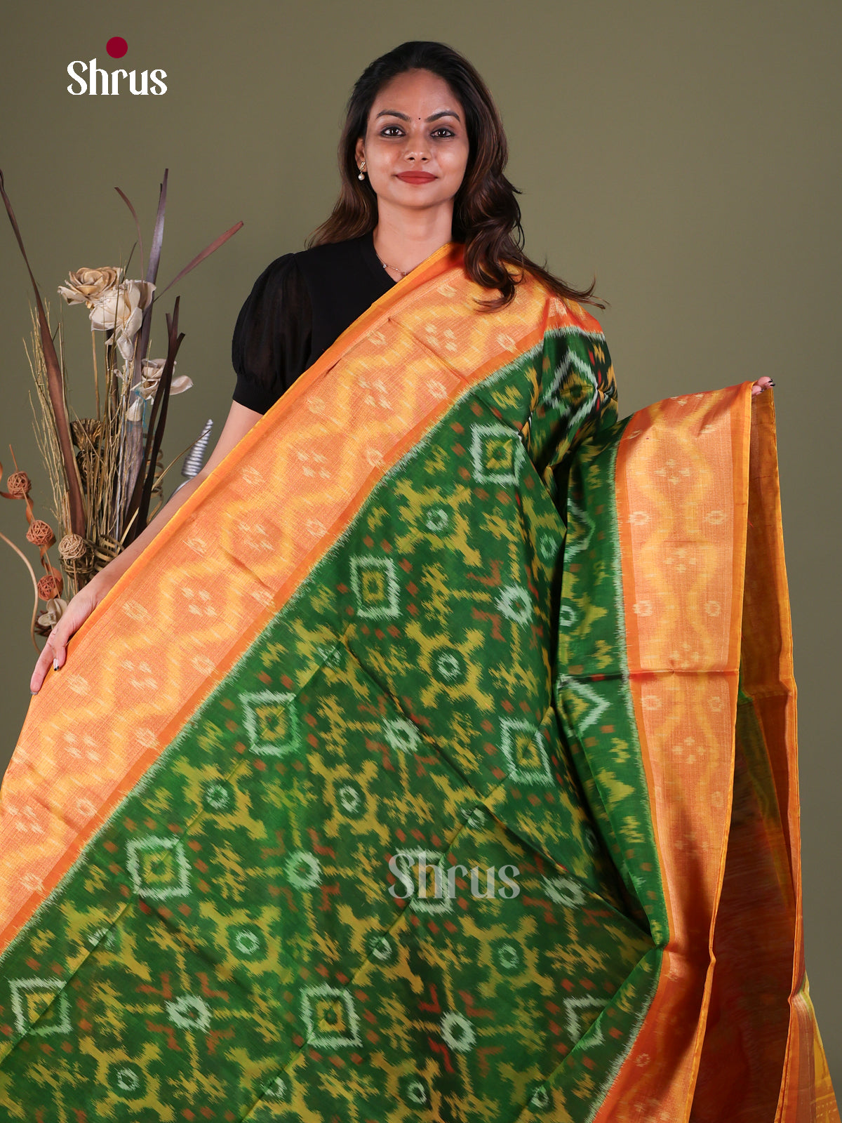 Exquisite Green Pochampally Cotton Silk Saree With Geometric Ikat Prints & Orange Floral Border