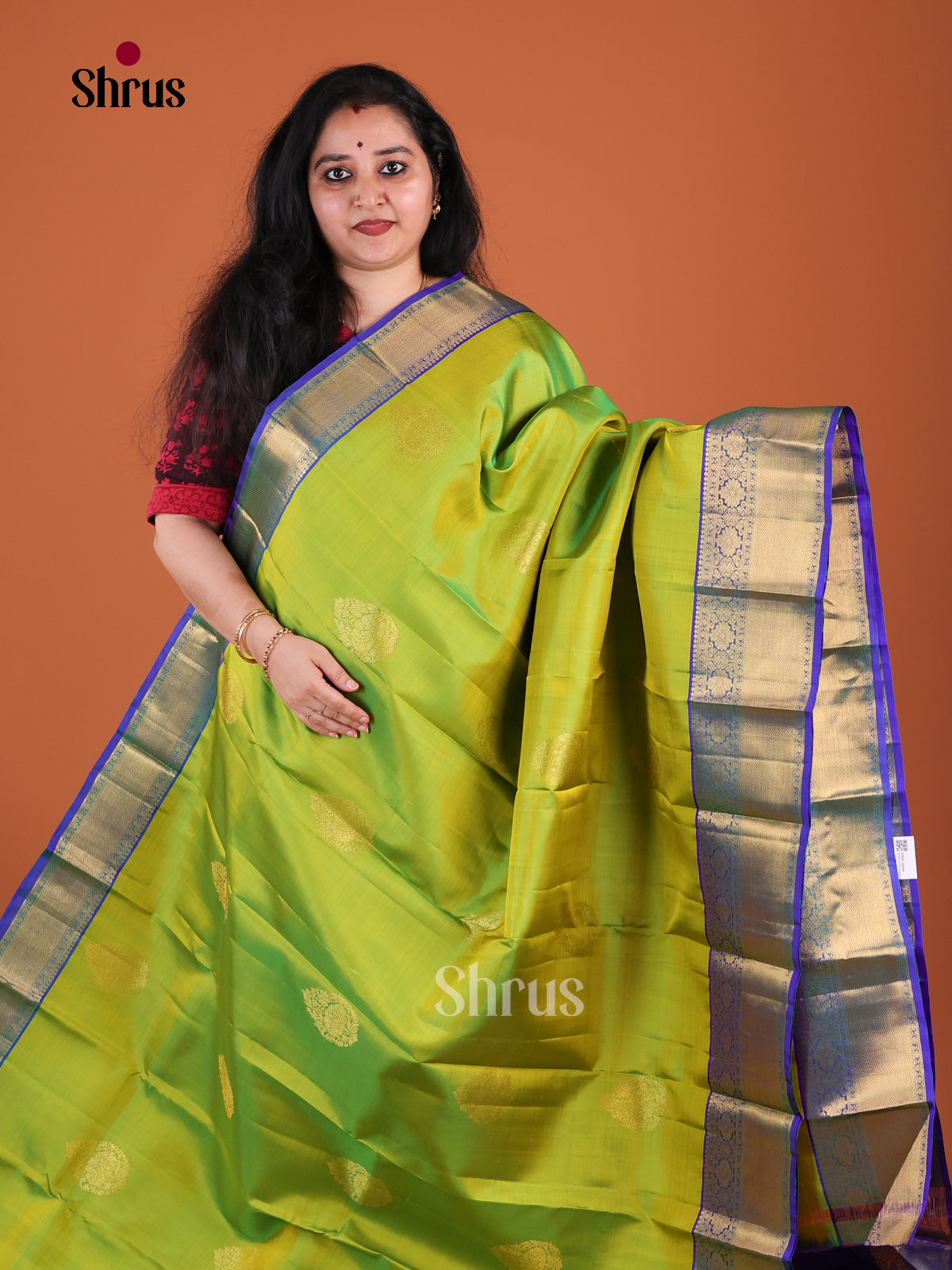 Exquisite Parrot Green Kanchipuram Pattu Saree With Leaf Motifs | Royal Blue Zari Woven Border & Pallu