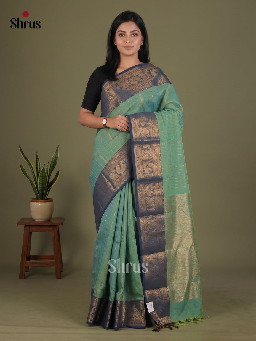 Exquisite Sea Green Chettinad Cotton Saree With Golden Stripes & Blue Zari Border