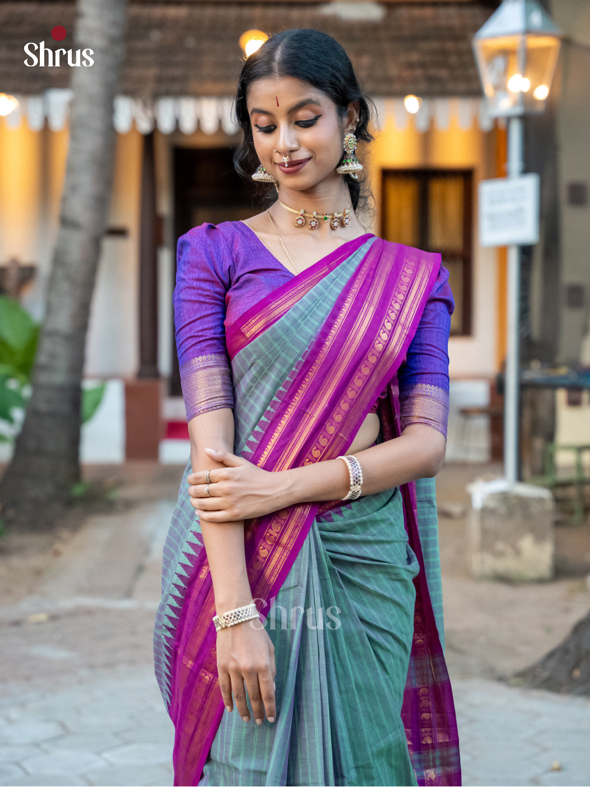 Graceful Dual Tone Green Chettinad Cotton Saree With Stripes & Purple Temple Zari Border - Shop on Shrus.com