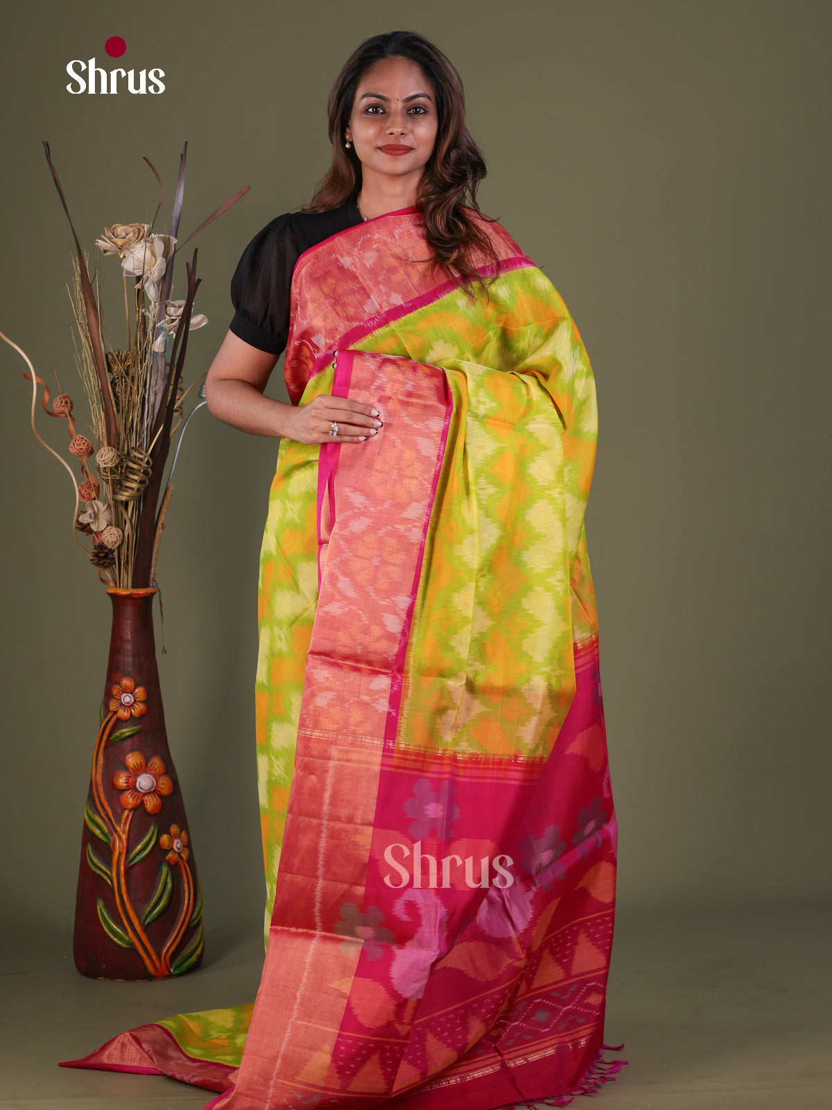 Luminous Mustard Green Pochampally Silk Cotton Saree With Ikat Prints & Pink Floral Border