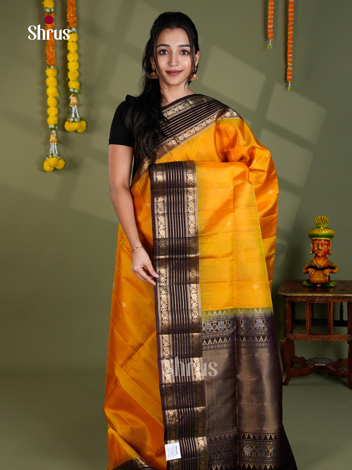Luminous Mango Yellow Soft Silk Saree With Small Buttas & Dark Brown Rettaipet Zari Border
