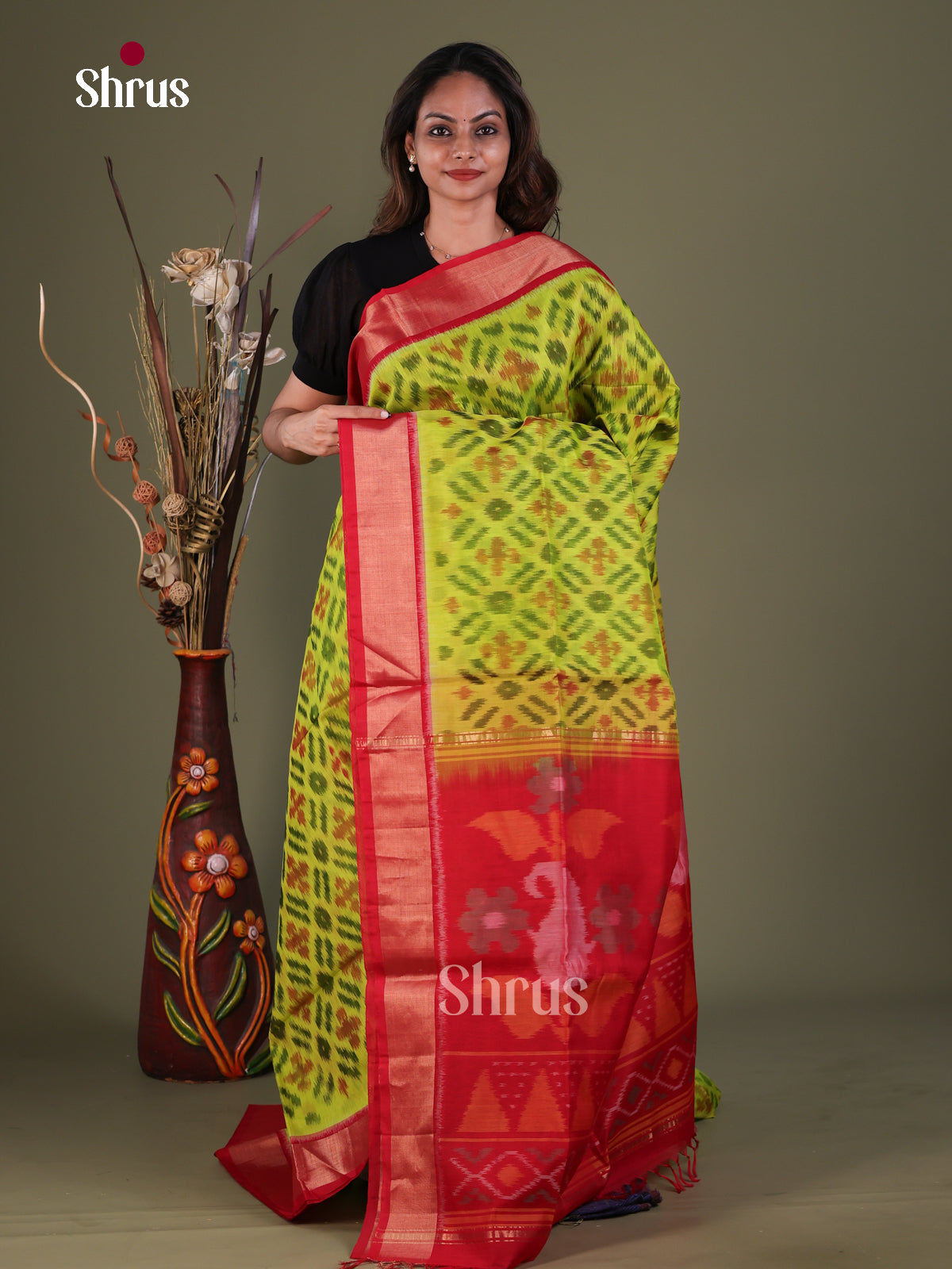 Opulent Lime Green Pochampally Silk Cotton Saree With Diamond Prints & Red Kaddi Border