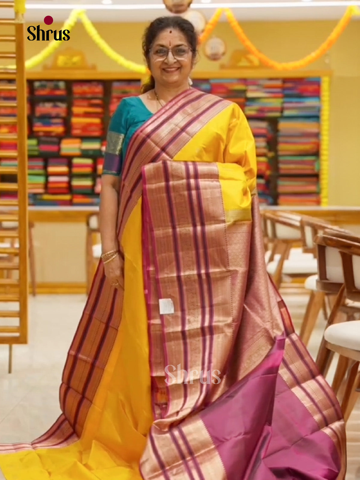 Opulent Yellow Kanchipuram Saree With Plain Body, Deep Purple Broad Zari Border & Pallu