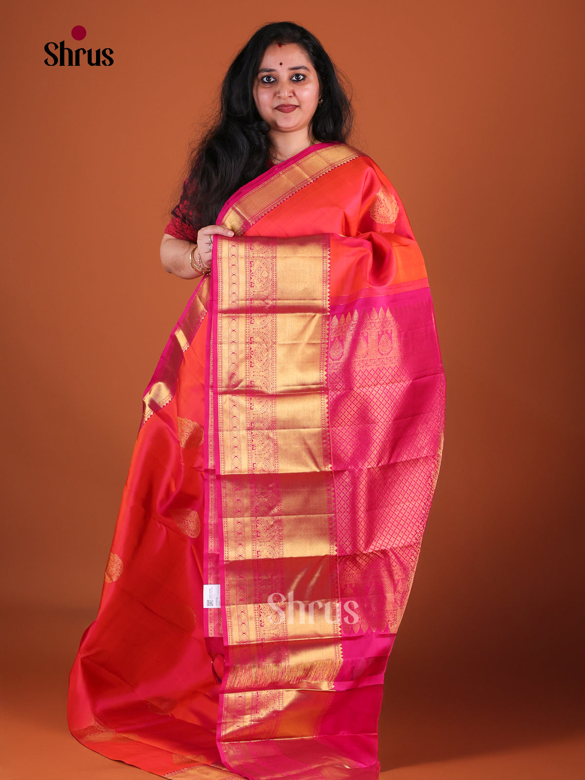 Regal Pinkish Orange Kanchipuram Silk Saree With Thilagam Motifs | Magenta Zari Border & Pallu