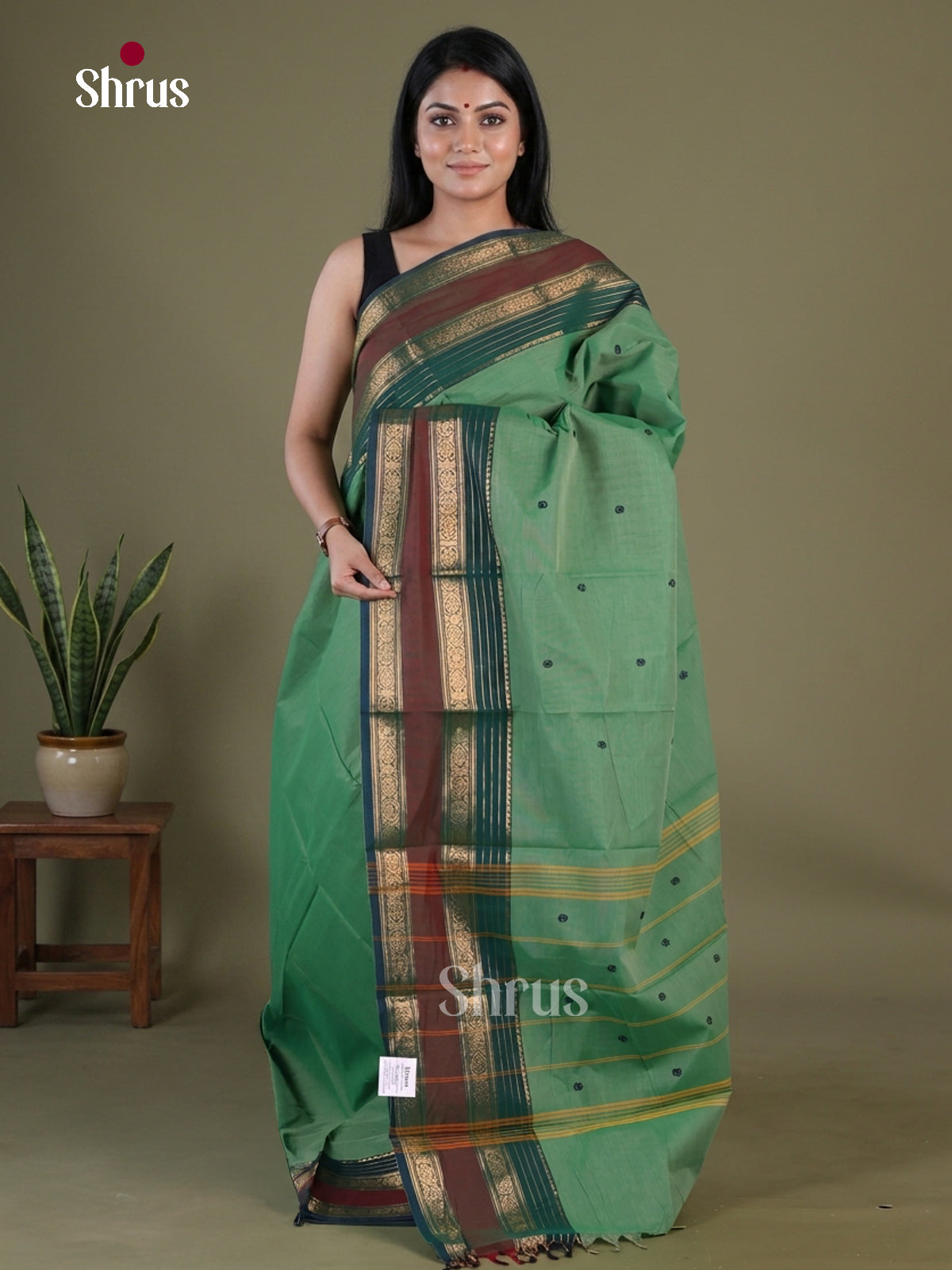 Serene Sage Green Chettinad Cotton Saree With Floral Buttas & Dark Green Zari Striped Border