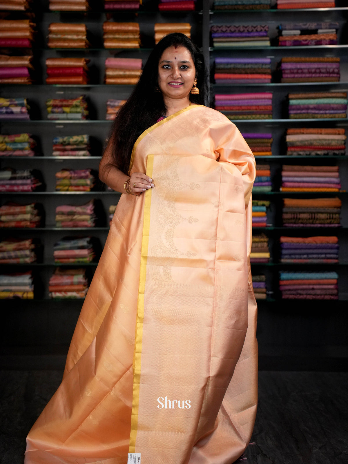 Sheeny Peach Kanchipuram Saree With Floral Motifs, Zari Border & Brocade Pallu