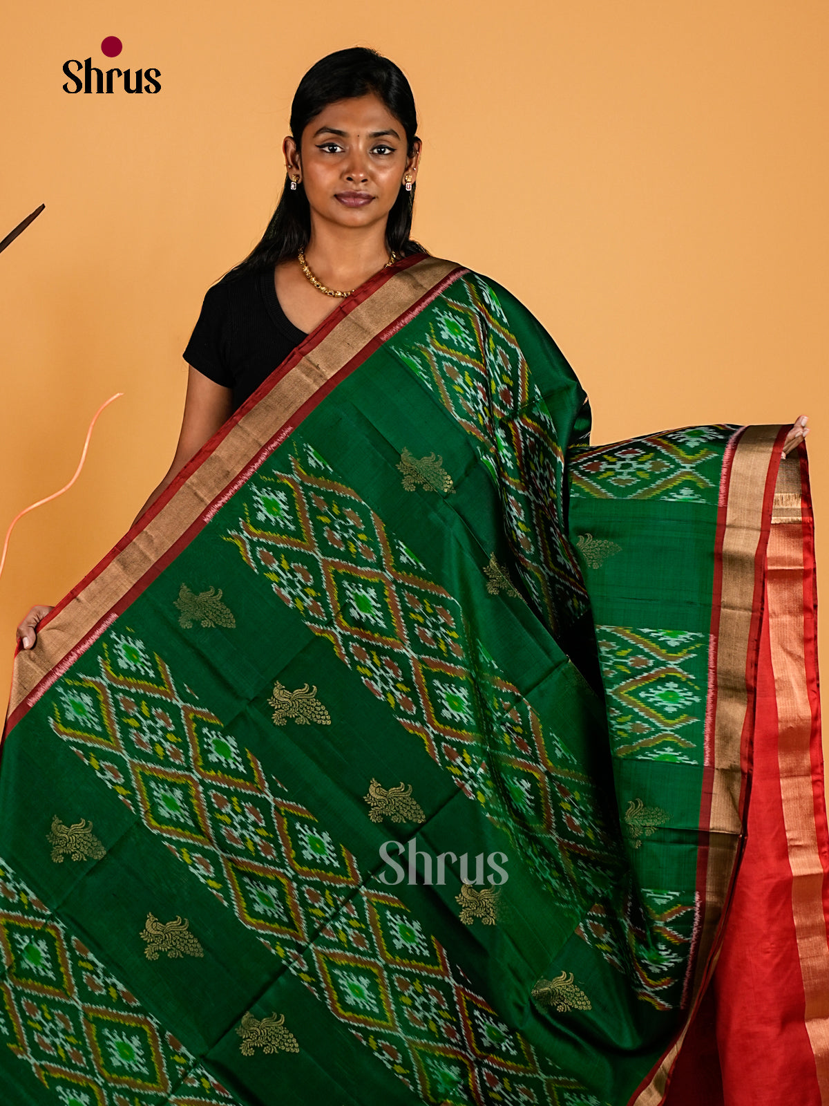 Splendid Bottle Green Soft Silk Sarees With Ikat Motifs, Peacock Buttas & Crimson Red Kaddi Zari Border 1