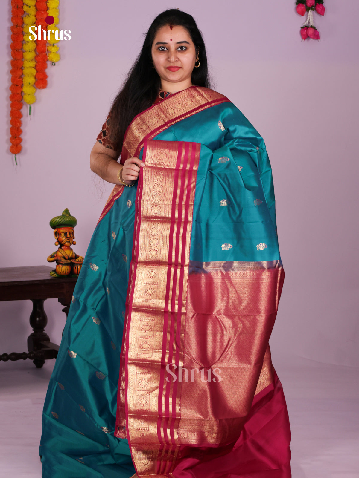 Buy Pretty Teal Blue Kanchipuram Silk Saree with Zari Buttas, & Dark Pink Zari Border & Pallu