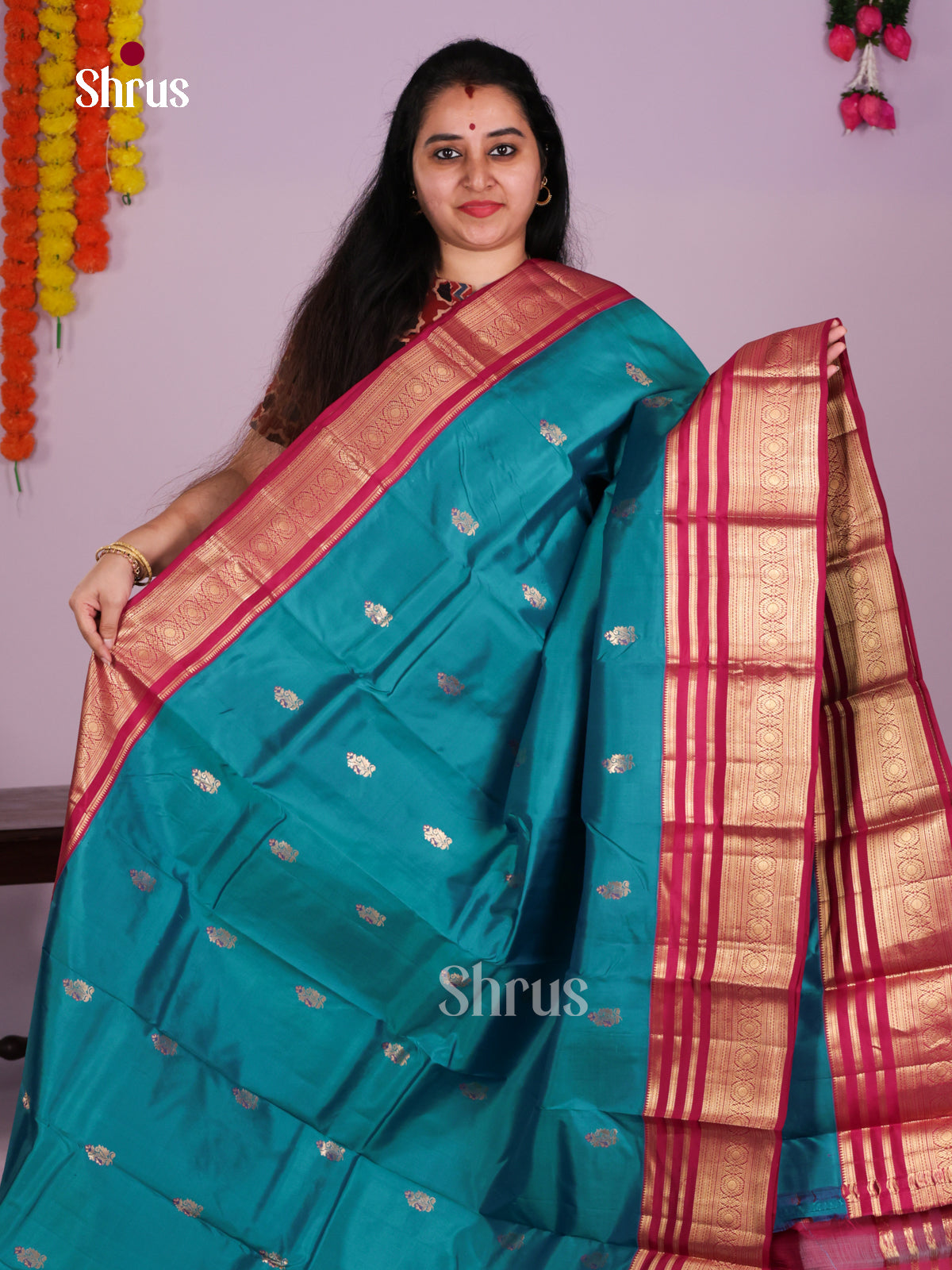 Buy Pretty Teal Blue Kanchipuram Silk Sarees with Zari Buttas, & Dark Pink Zari Border & Pallu