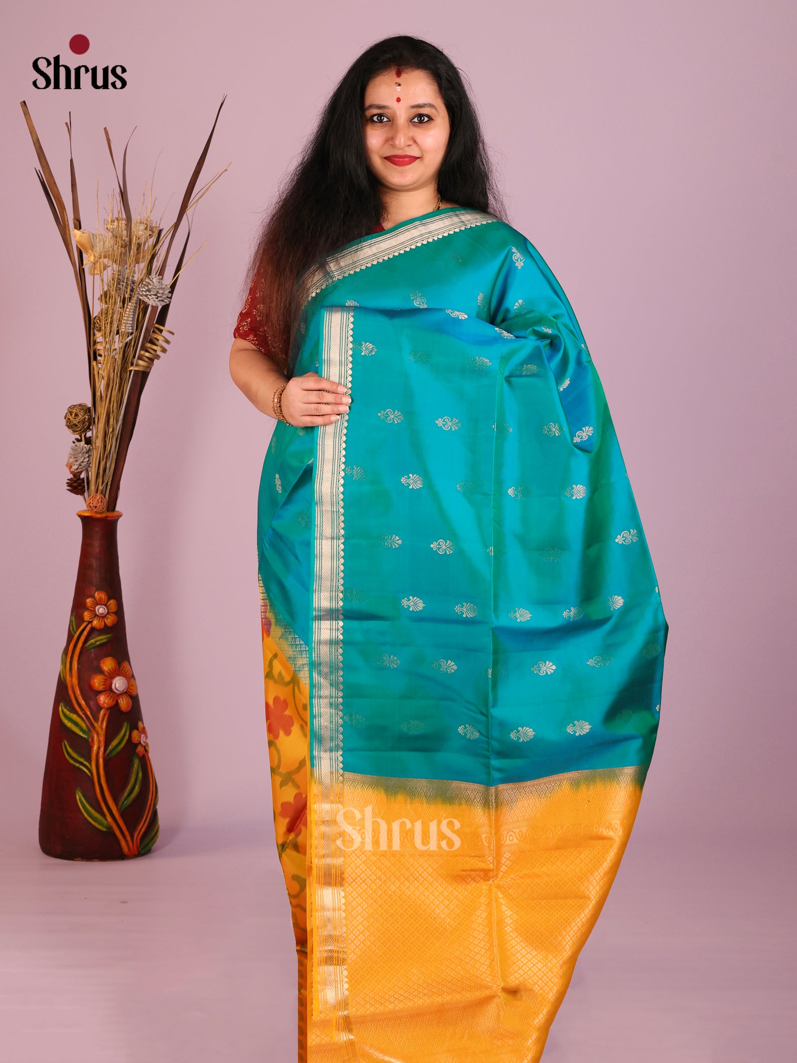 Buy Brilliant Teal Half & Half Soft Silk Saree with Floral Buttas & Mustard Ikat Floral Nestling