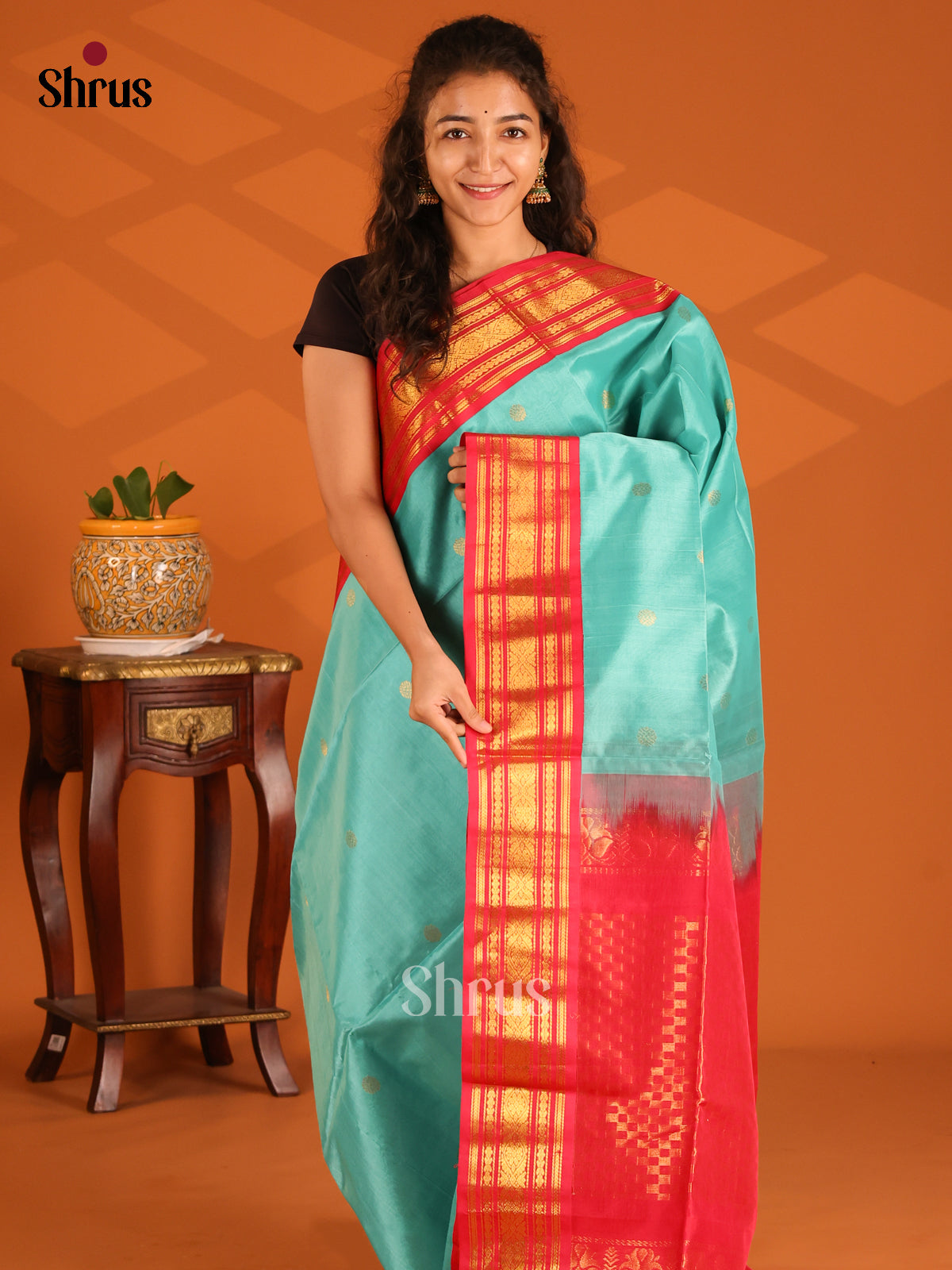 Buy Gleaming Turquoise Silk Cotton Saree with Gold Rudraksh Buttas & Red Zari Border