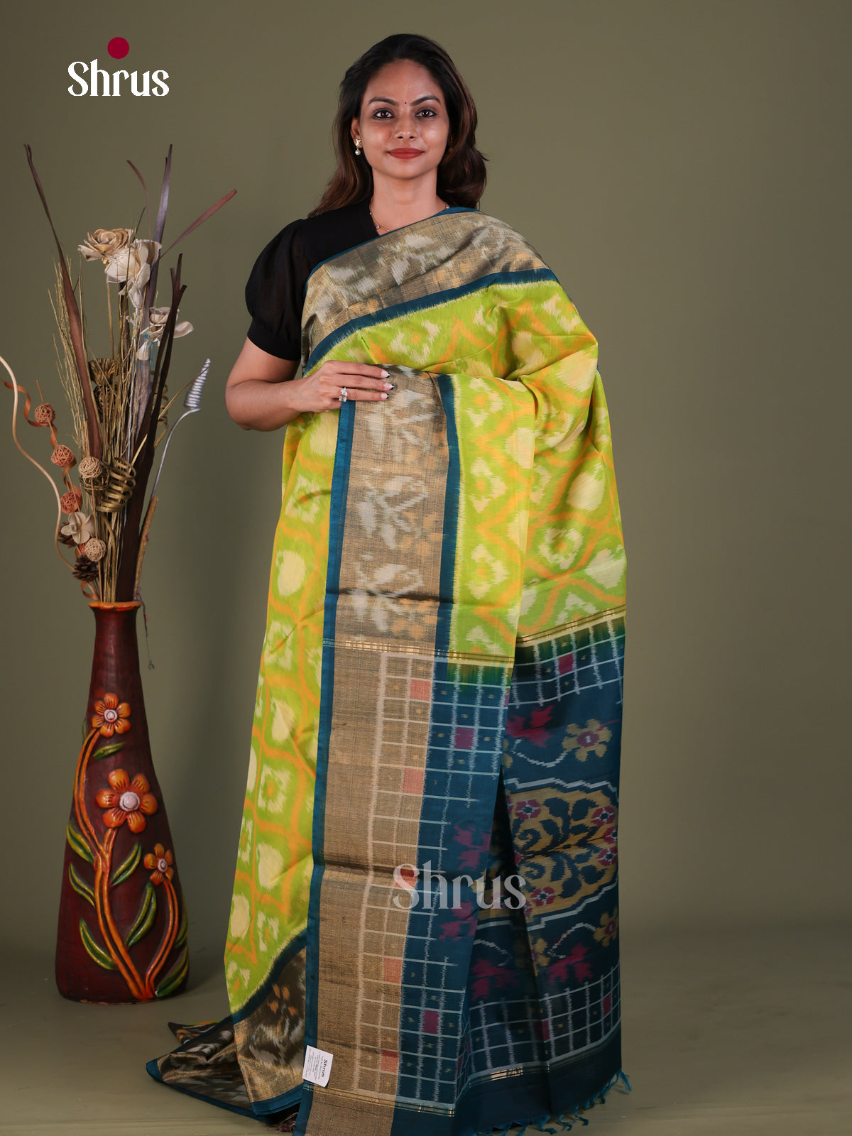 Unique Chartreuse Green Pochampally Silk Cotton Saree With Geometric Prints & Teal Border