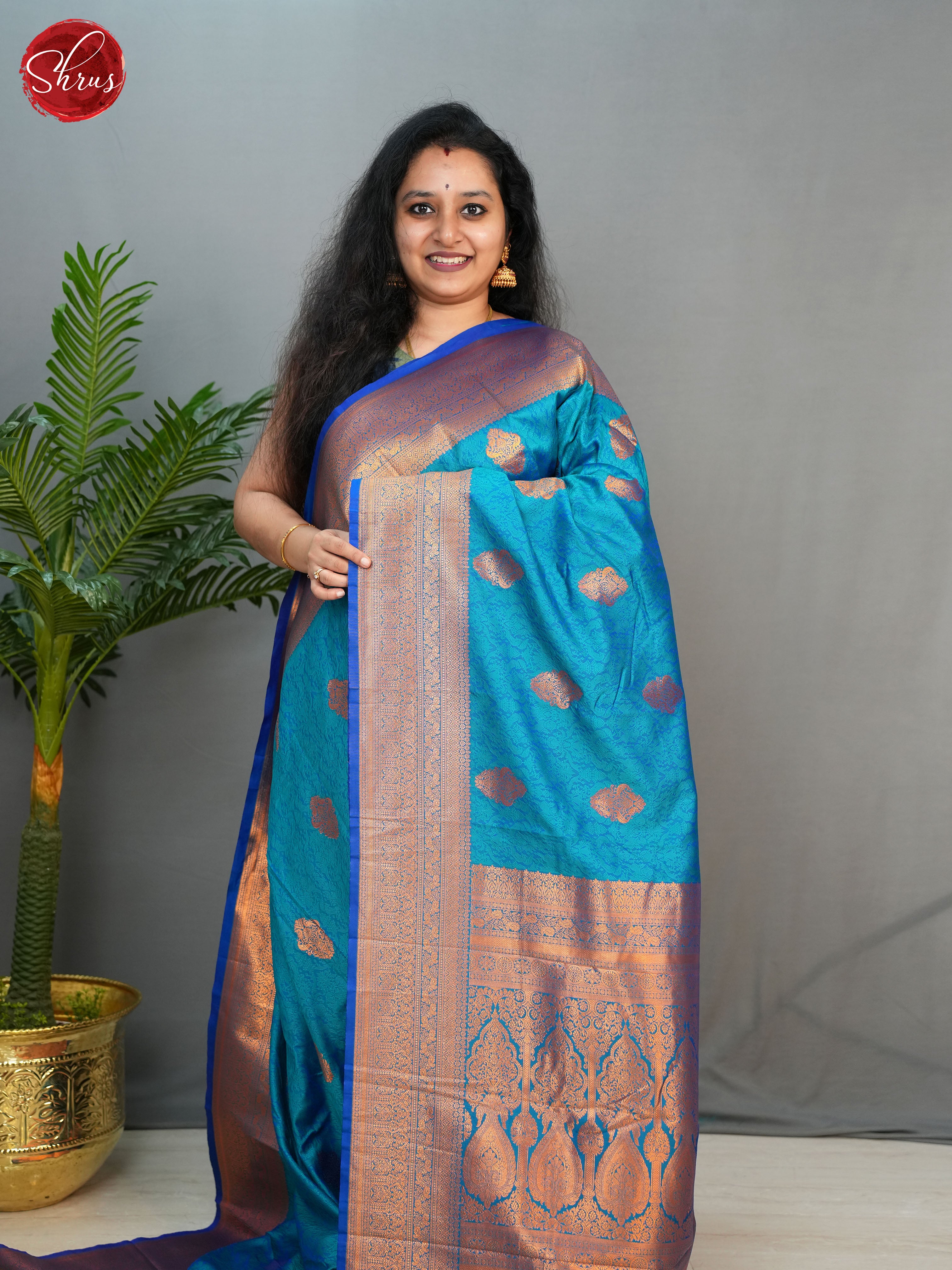 Blue (Single Tone)- Semi Kanchipuram with  Zari woven  floral motifs  on the body & Contrast Zari Border - Shop on ShrusEternity.com