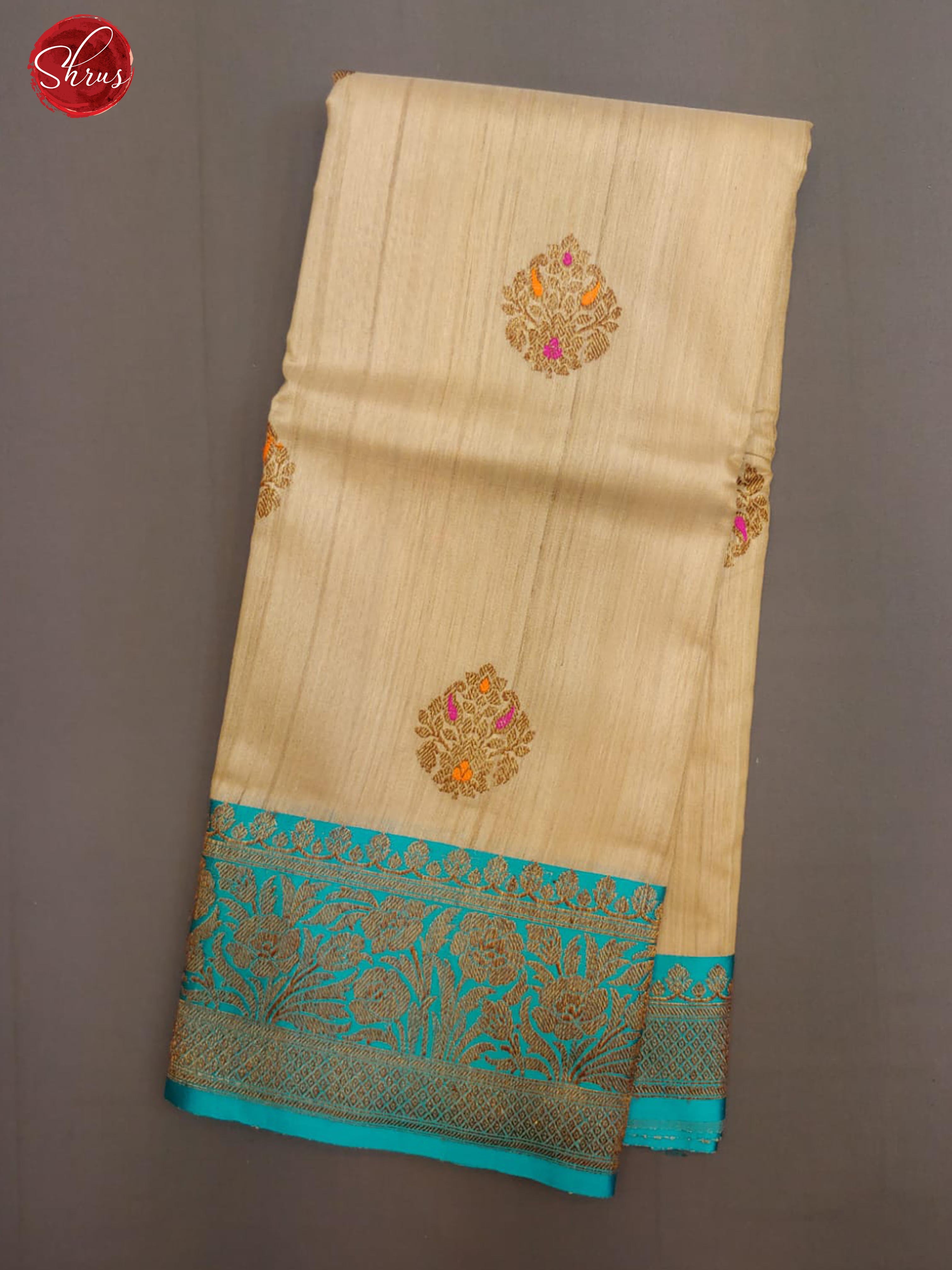 Beige & Blue - Dupion Silk with zari woven floral motifs on the body & Contrast Gold zari Border - Shop on ShrusEternity.com