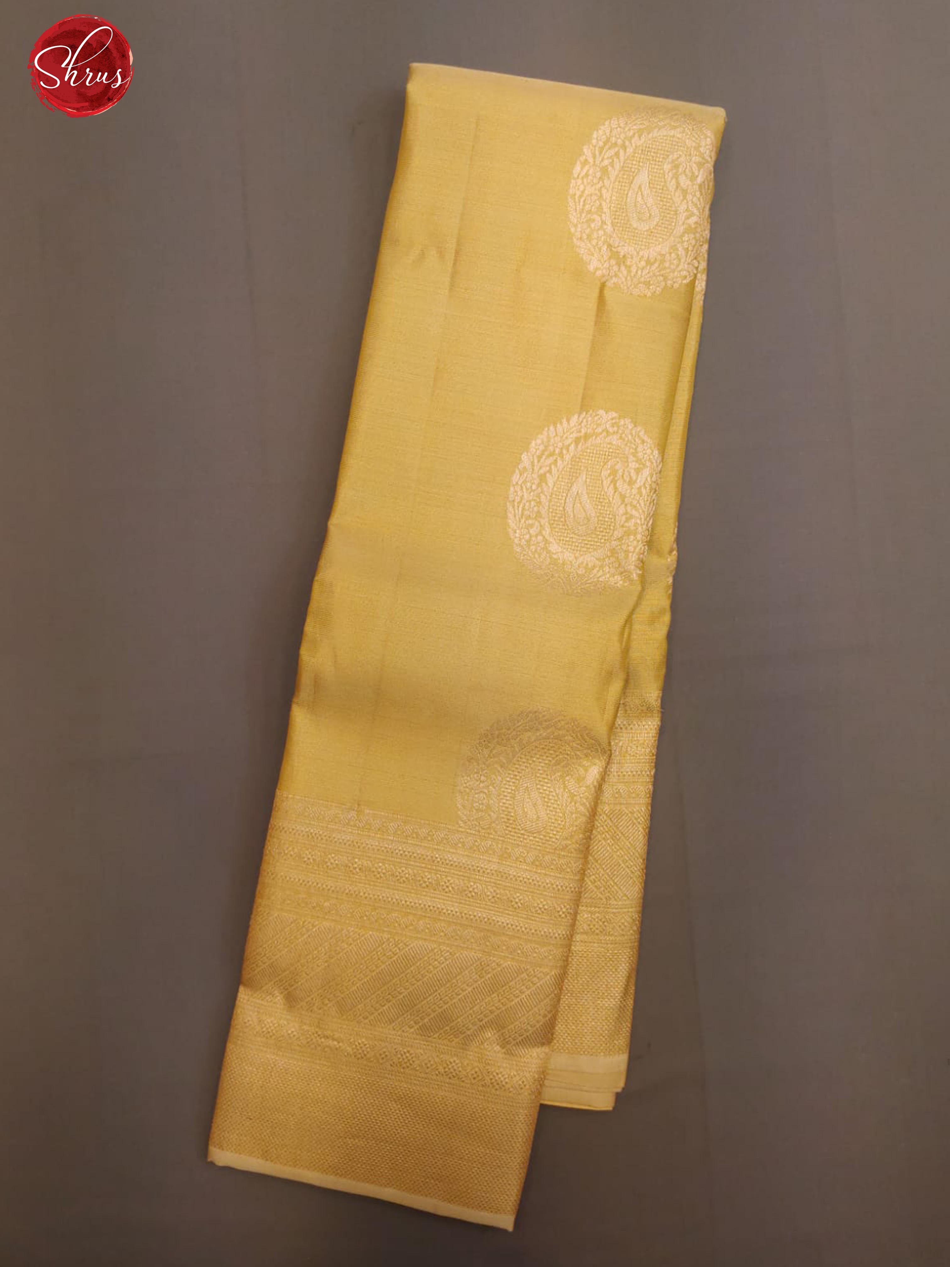 Beige(Single Tone)- Kanchipuram Silk with zari woven floral motifs on the body &   Zari Border - Shop on ShrusEternity.com