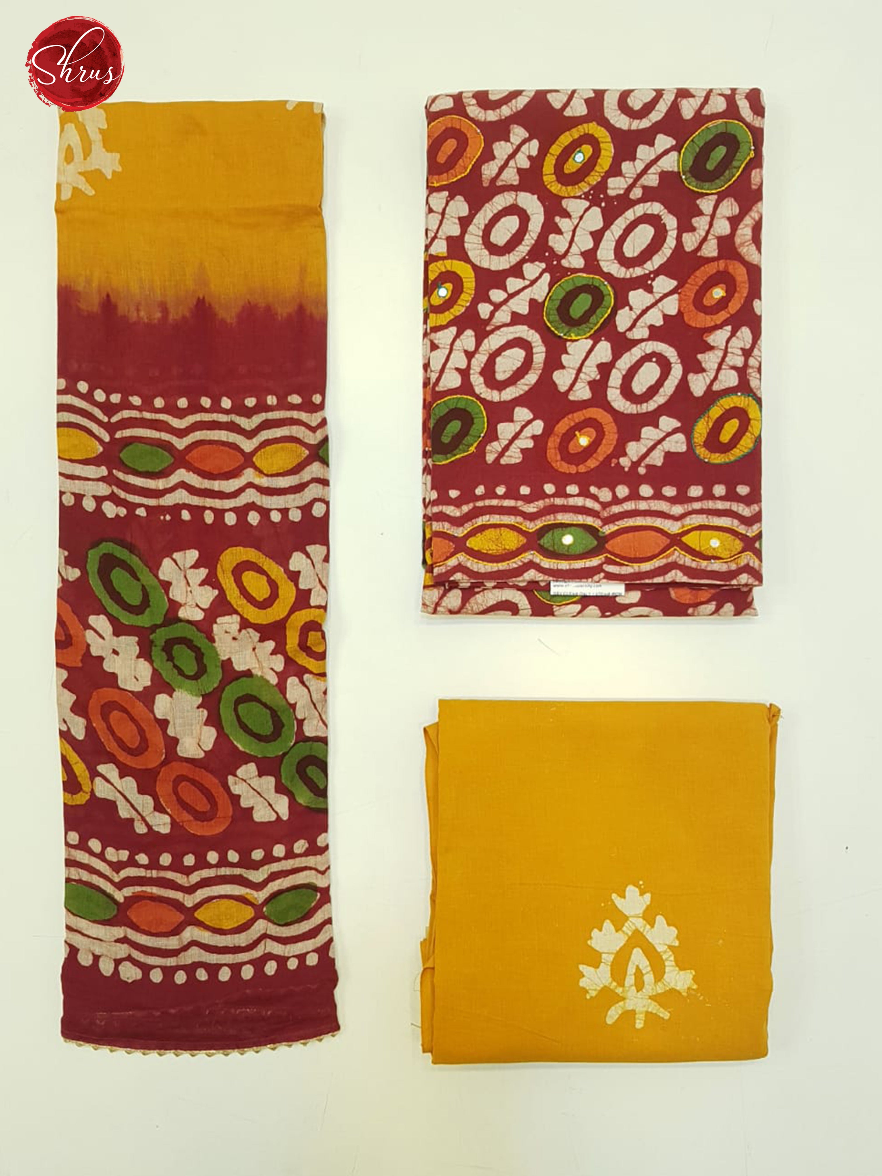 Red & Yellow -Bhatik  Suit with floral   print , mirror embroidery on the top(In all suits the left part is the Dupatta , Top right pic is top and Bottom Right is the bottom) - Shop on ShrusEternity.com