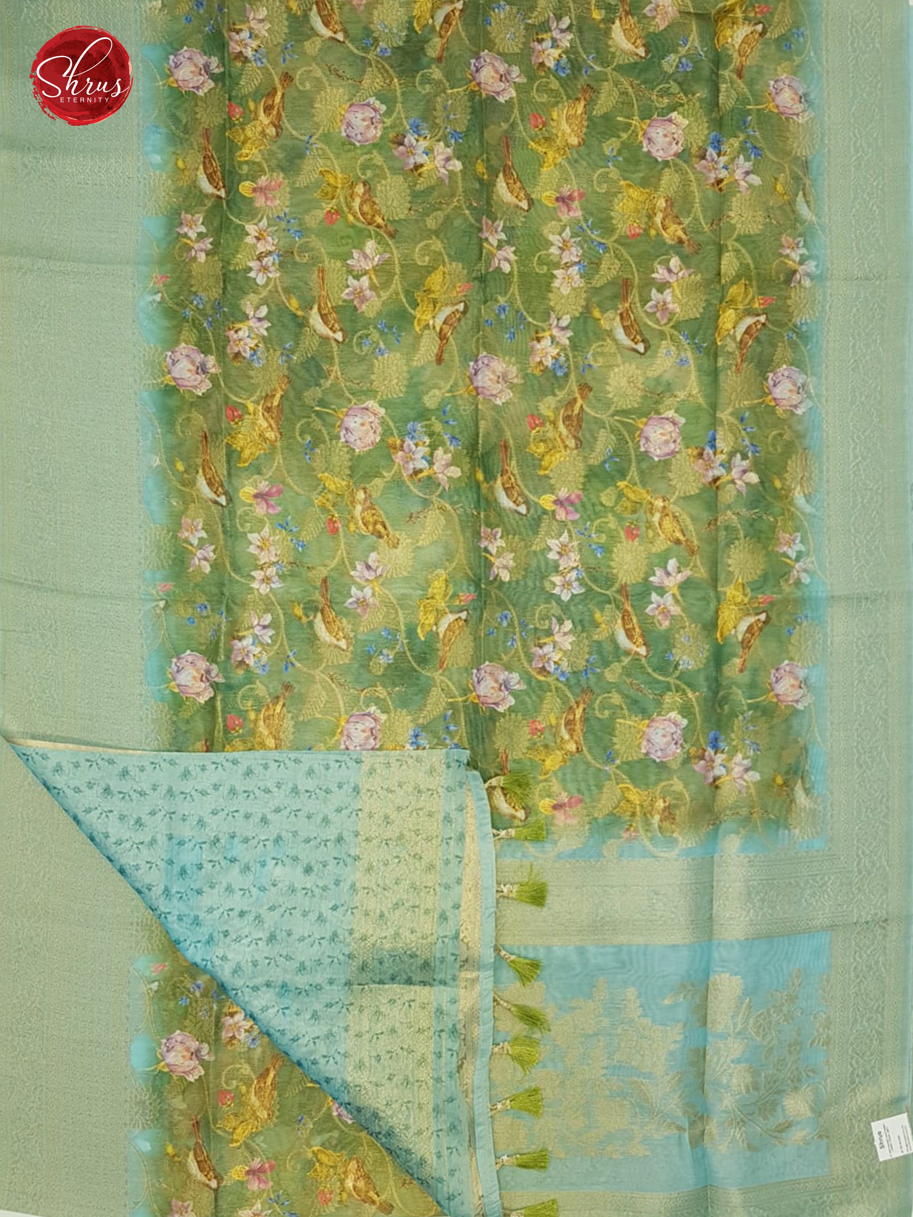 Green & Blue - Semi Jute with floral  Print , zari floral nestling on the  Body & zari Border - Shop on ShrusEternity.com