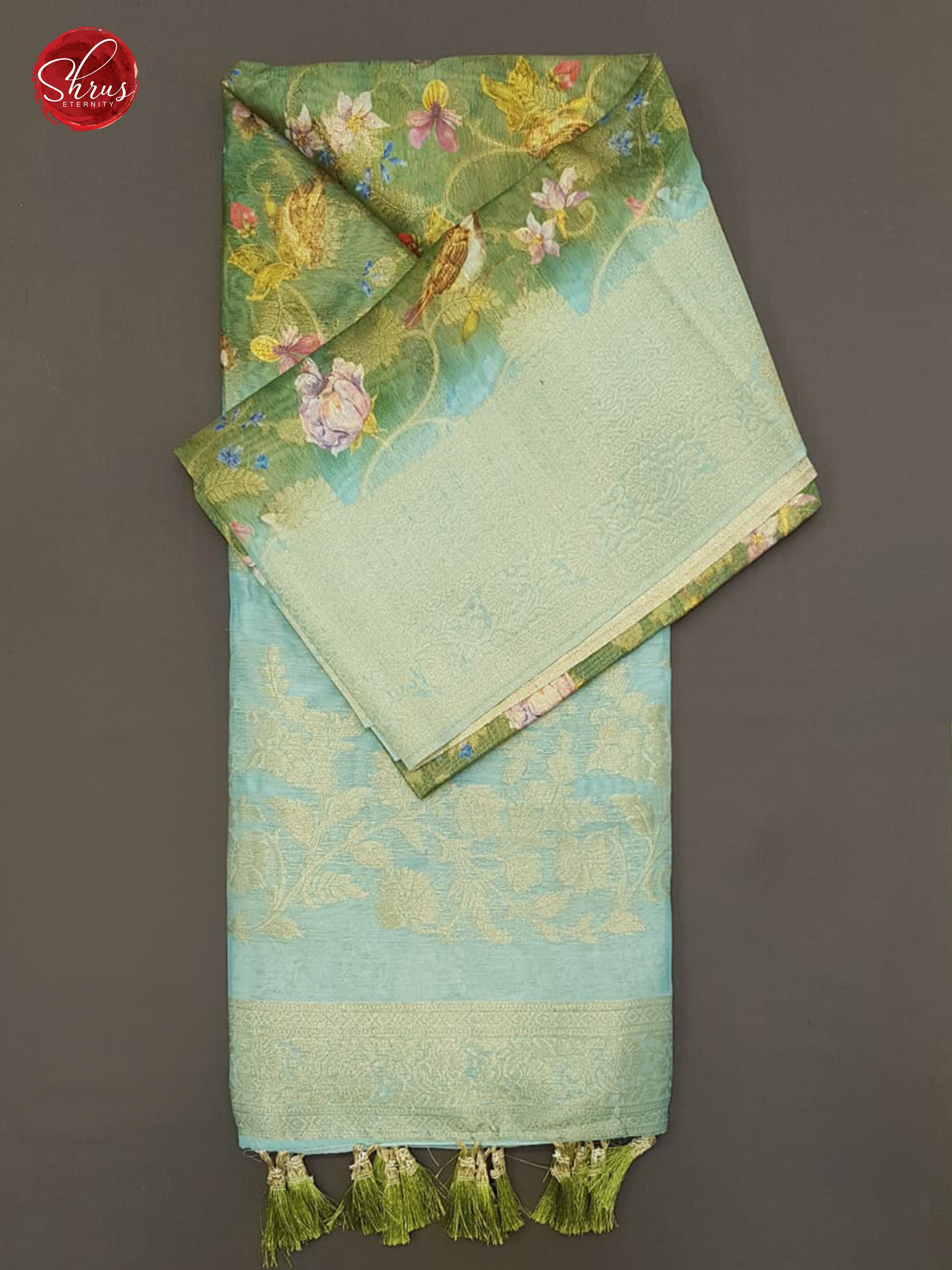 Green & Blue - Semi Jute with floral  Print , zari floral nestling on the  Body & zari Border - Shop on ShrusEternity.com