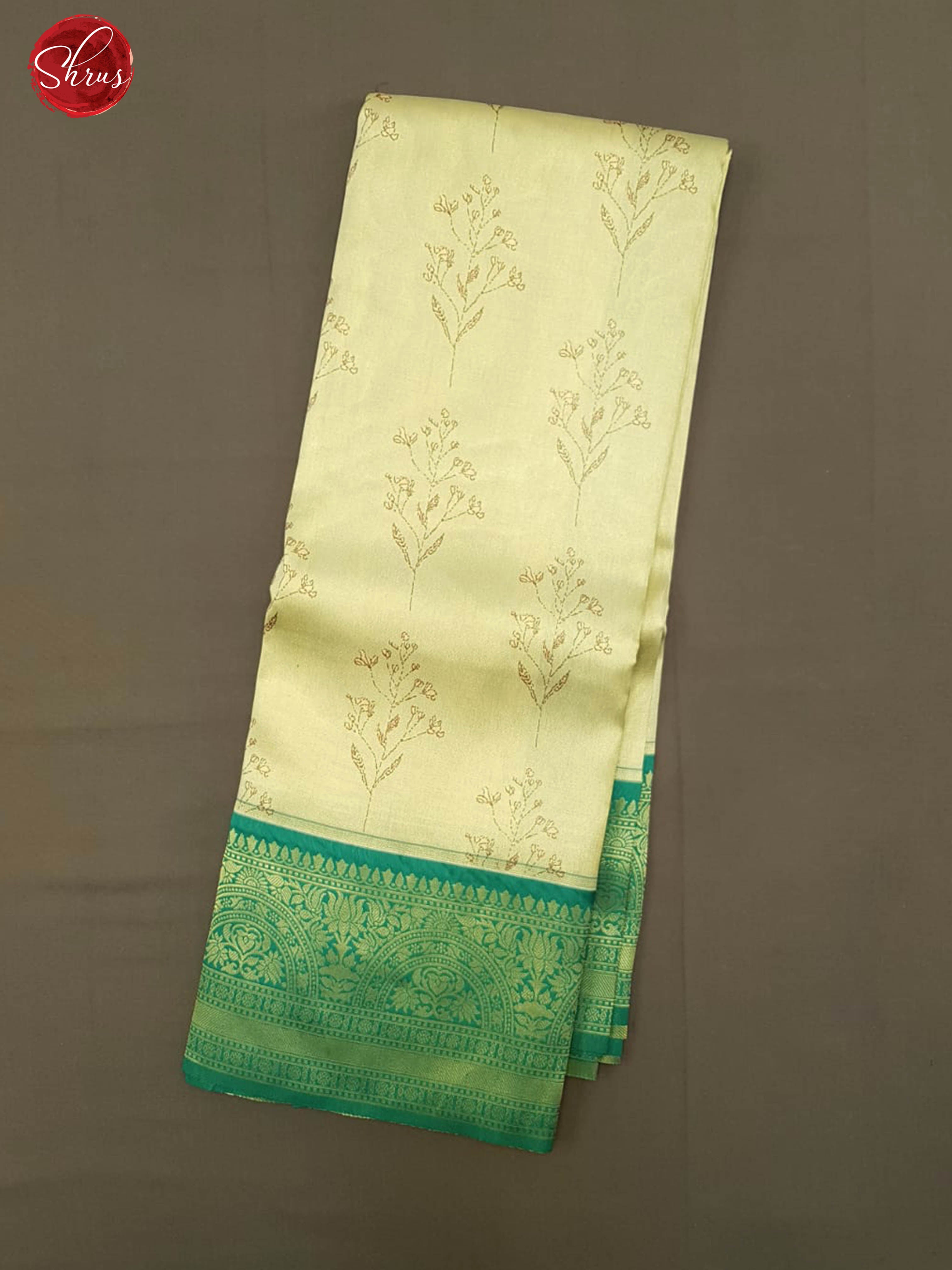 Cream & Green- Semi Kanchipuram Silk with zari woven floral motifs on the body & contrast zari border - Shop on ShrusEternity.com