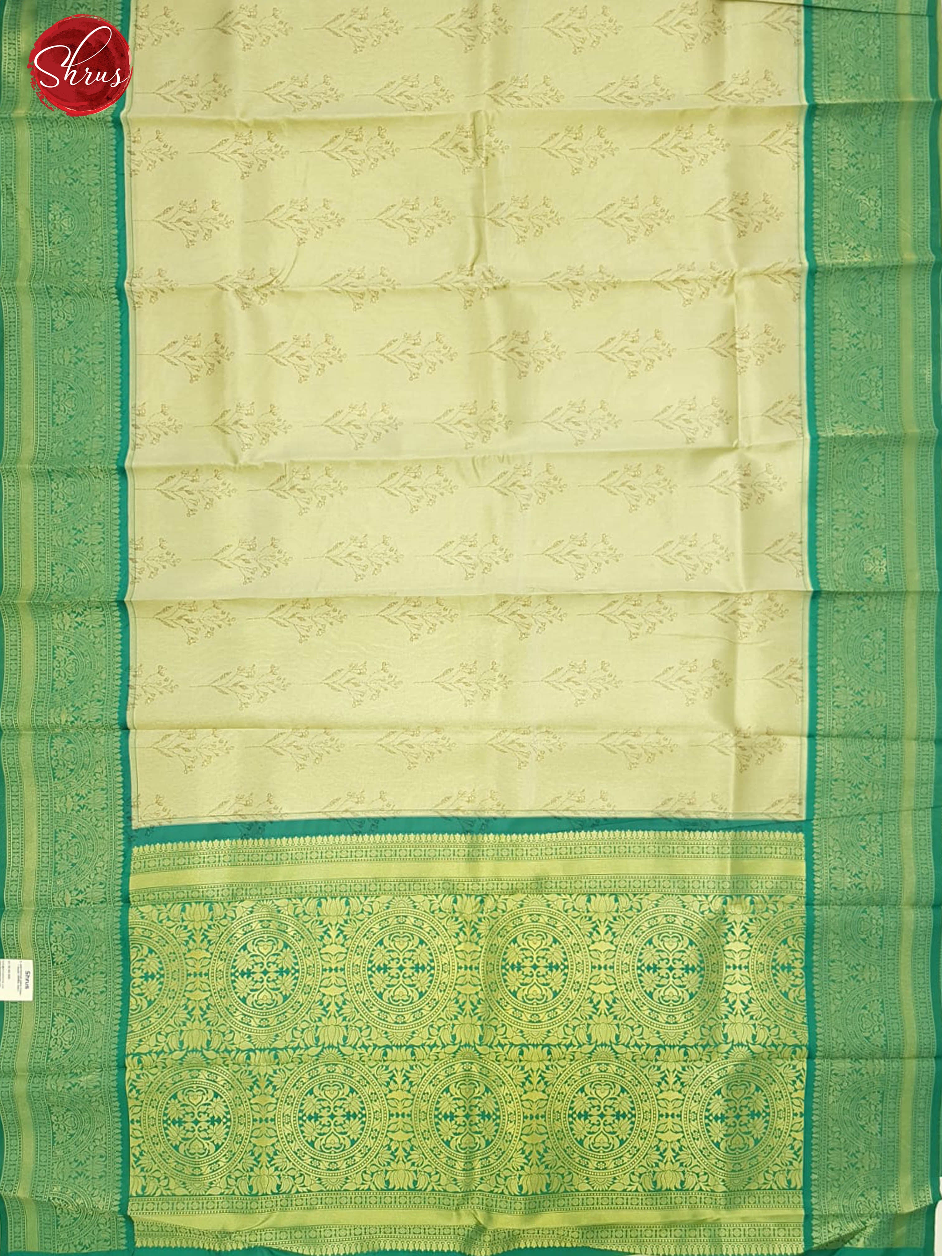 Cream & Green- Semi Kanchipuram Silk with zari woven floral motifs on the body & contrast zari border - Shop on ShrusEternity.com