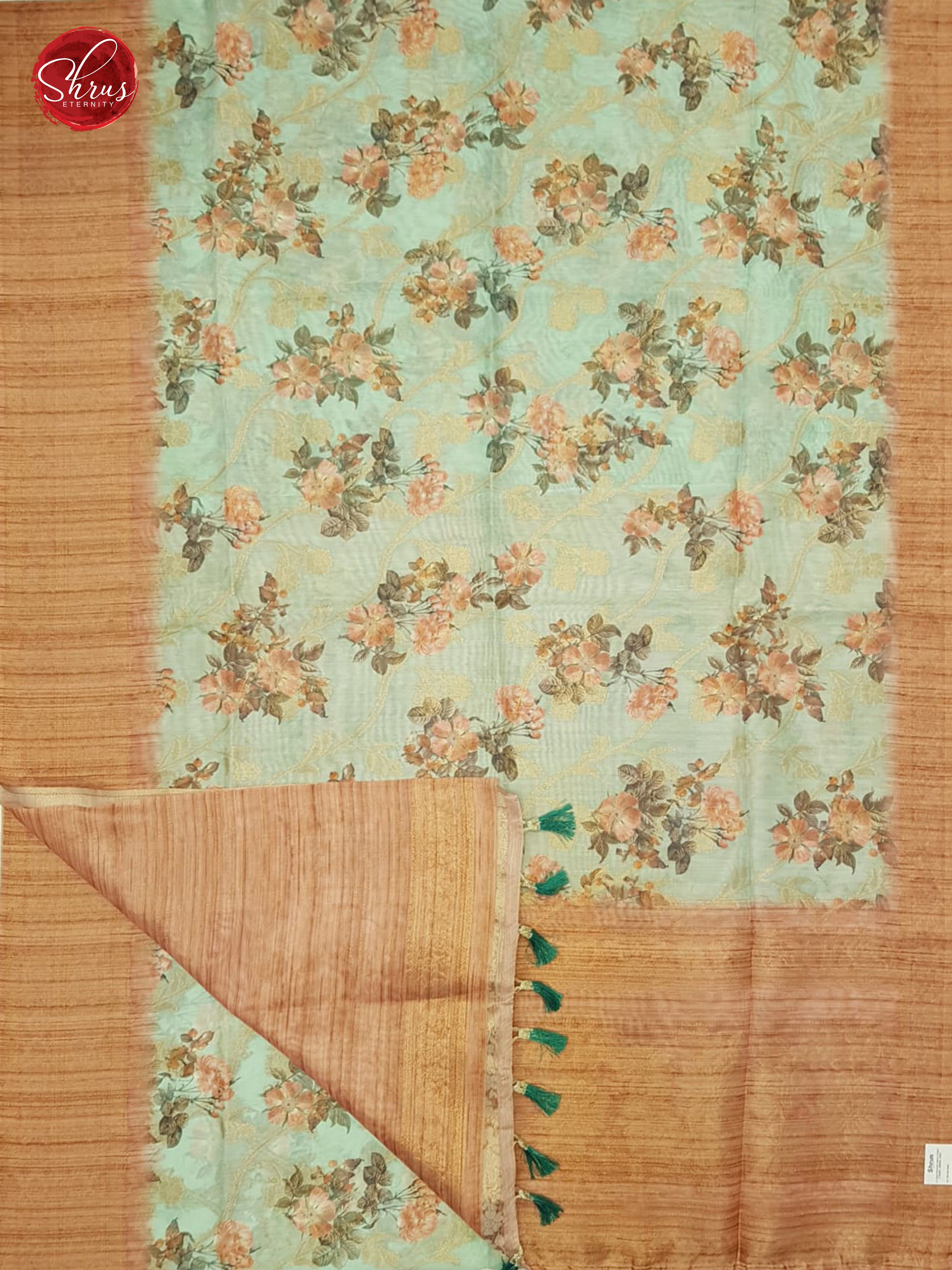 Green & Brown -  Semi Jute with floral  Print , zari floral nestling on the  Body & zari Border - Shop on ShrusEternity.com