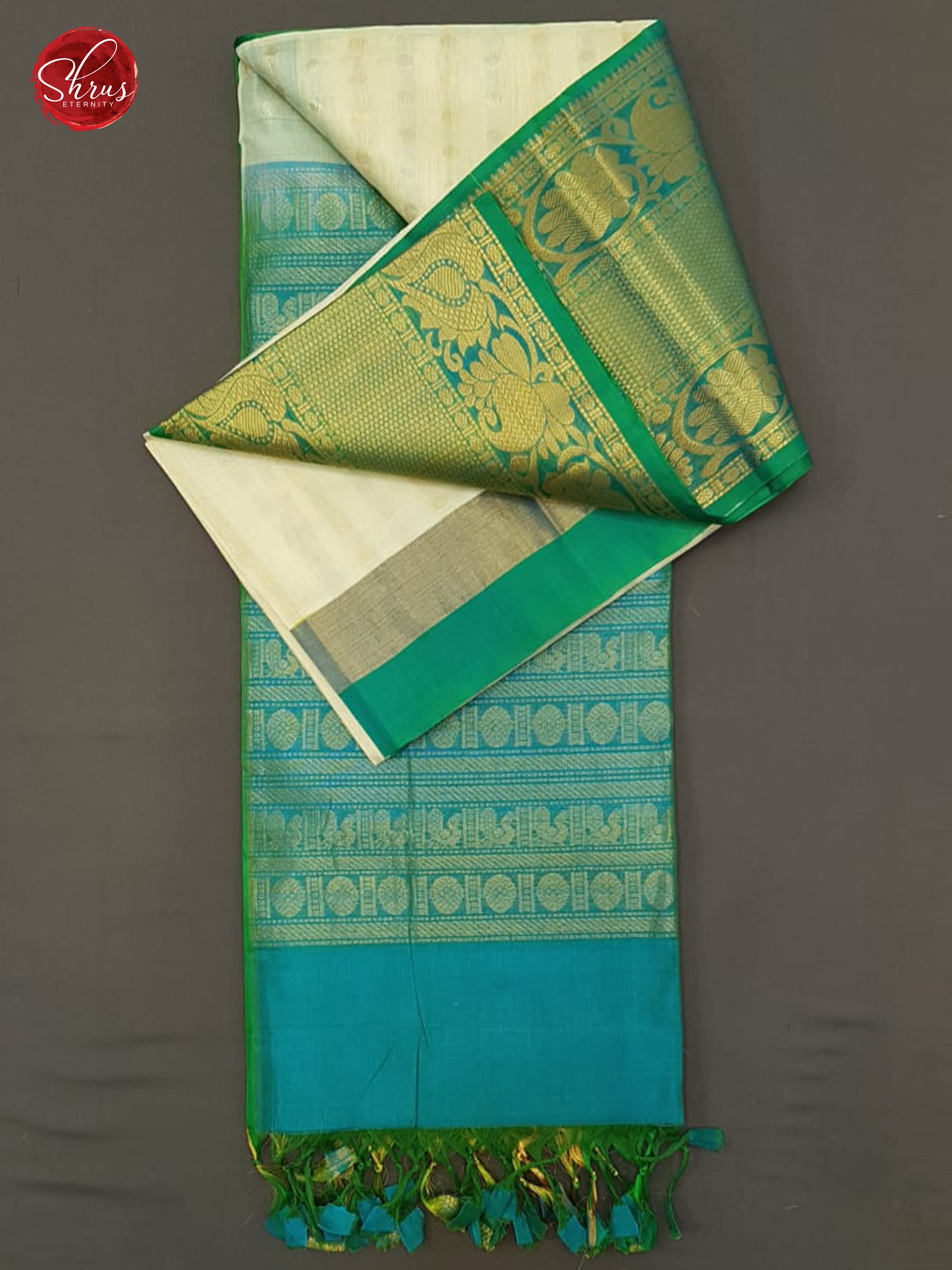 Cream & Teal Blue- Silk Cotton with zari  buttas on the body& Zari Border - Shop on ShrusEternity.com
