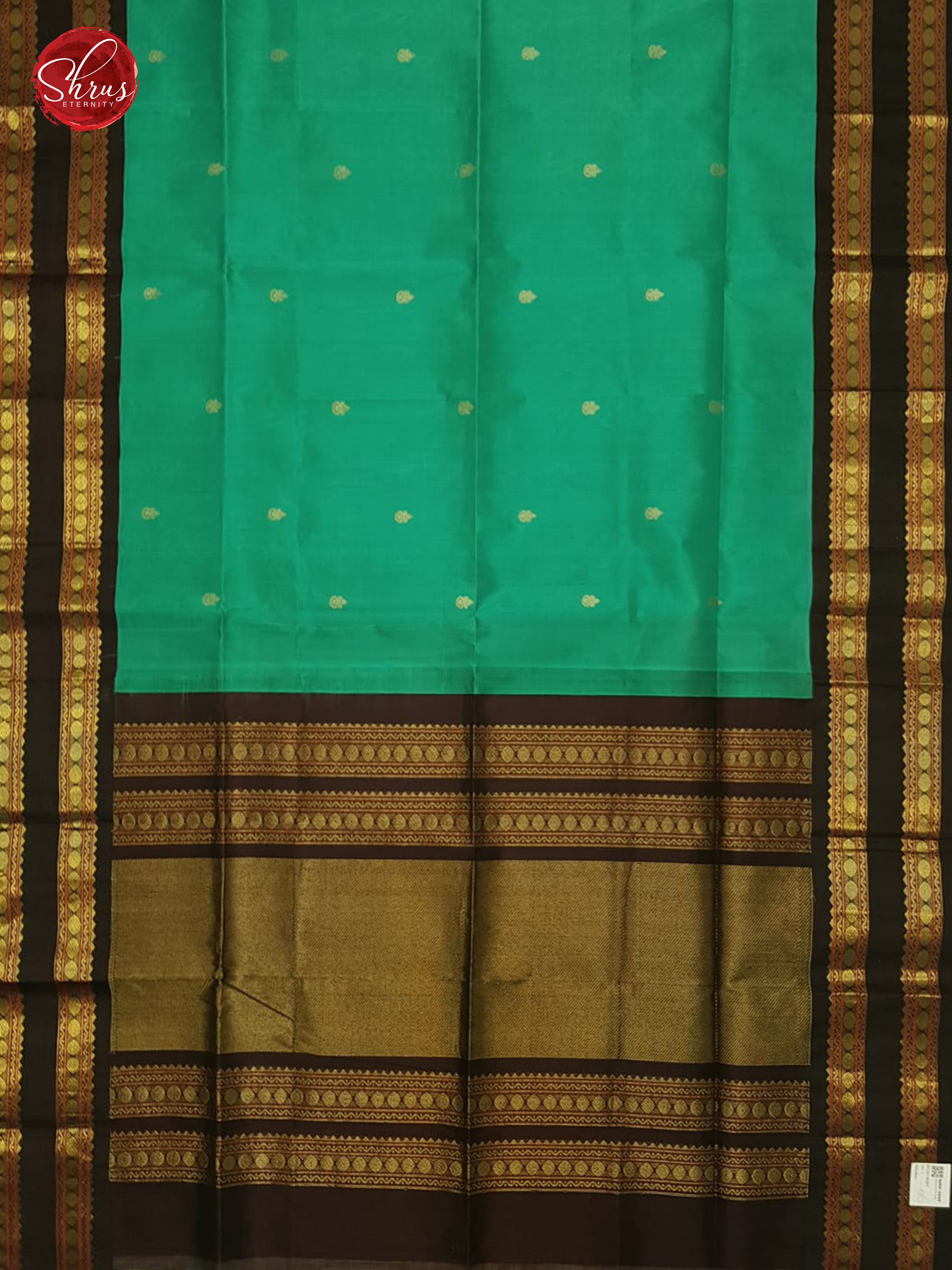 Teal Green & Brown - Silk Cotton with zari woven buttas on the  Body & Contrast Gold Zari Border - Shop on ShrusEternity.com