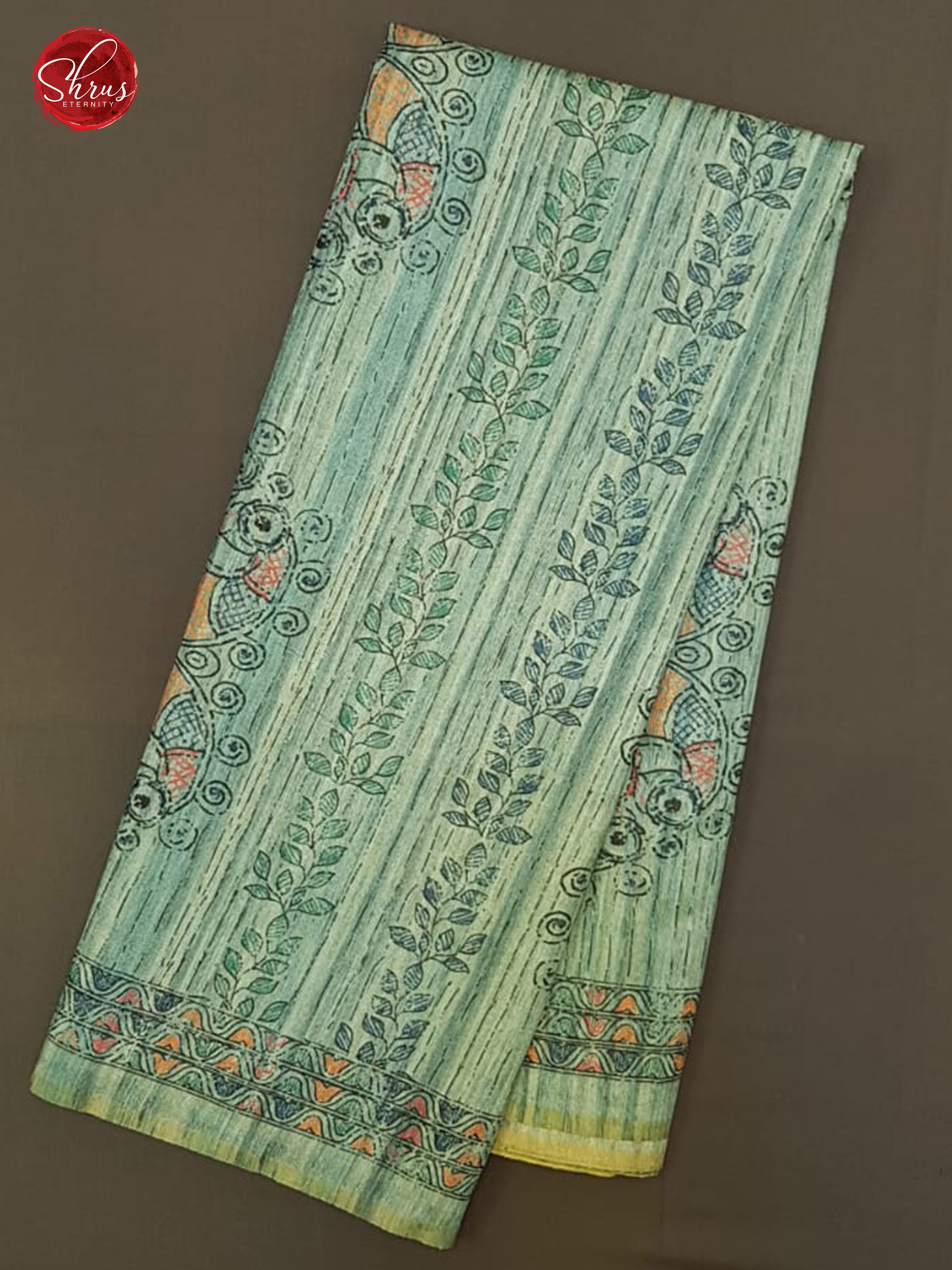 Blue(Single Tone)- Semi Gicha with floral print on the body & Zari Border - Shop on ShrusEternity.com