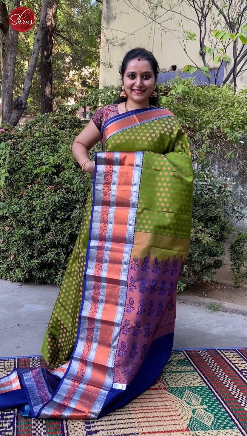 Green & Blue - Kanchipuram Silk with copper  zari floral buttas on the  body & copper , silver zari border - Shop on ShrusEternity.com